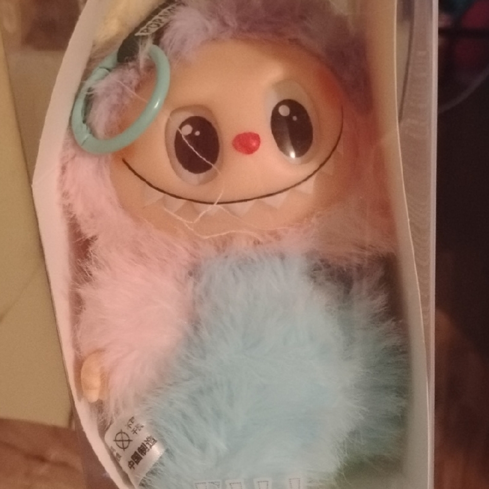Adorable Plush Doll with Light Blue and Pink Fur